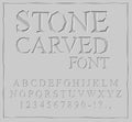 Stone Carved font. Alphabet on rock plate. Chips and scratches. Royalty Free Stock Photo