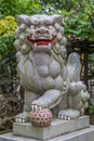 Stone carved Komainu Lion-dog guardian at Suzukamyo Shrine, Located in Zama city.