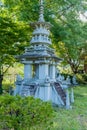 Pagoda under shade tree at Buddhist temple Royalty Free Stock Photo