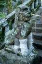 Stone carved statue of a guardian dog in Suwa Shinto Shrine in Nagasaki, Japan.