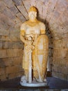A stone carved statue of a knight in the Castle of Beja