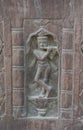 Stone carving art with lord Krishna  figure on the pillar of ancient architecture of India Royalty Free Stock Photo