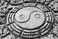 The stone carving of chinese yin yang symbol.