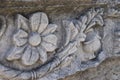 Stone carving depicting floral patterns on an ancient roman wall