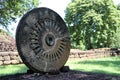 Stone carving of the wheel of the dharma. in archaeological site of Srithep ancient town in Petchaboon, Thailand.