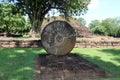 Stone carving of the wheel of the dharma. in archaeological site of Srithep ancient town in Petchaboon, Thailand.