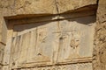 Stone carvings in bas-relief on the Tomb of Xerxes I at Persepolis, near Shiraz, in Iran.