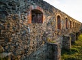 Stone castle wall with embrasure. Royalty Free Stock Photo