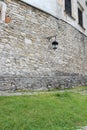 Stone castle wall and old lantern in summer on a sunny day Royalty Free Stock Photo