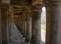 A stone causeway supported by many finely carved columns provides an impressive entrance to the Baphuon temple mountain
