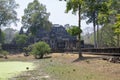 A stone causeway supported by many finely carved columns provides an impressive entrance to the Baphuon temple mountain