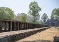 A stone causeway supported by many finely carved columns provides an impressive entrance to the Baphuon temple mountain