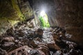 Stone cave inside view. Light exit