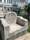 a stone chair on a city street. Varna. Bulgaria.