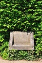 Stone chair in green Royalty Free Stock Photo