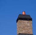 Stone Chimeny with Metal Cap Royalty Free Stock Photo