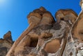 Stone chimneys with cave houses in Monks Valley, Cappadocia Turkey