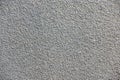 Stone chip rough textured wall painted grey