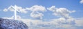 Stone christian cross against a cloudy sky - concept image with copy space