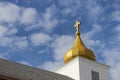 Stone church with gold dome steeple against blue skies Royalty Free Stock Photo