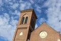 Stone church steeple against blue skies Royalty Free Stock Photo