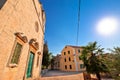 Stone church and street of Zlarin island Royalty Free Stock Photo