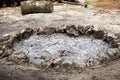 Stone circle fire pit with ash