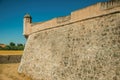 Stone city wall corner with watchtower and dry moat Royalty Free Stock Photo