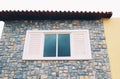 Stone cladding plates on the wall with one window Royalty Free Stock Photo