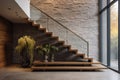 Stone cladding wall in spacious hallway with staircase. Luxury minimalist home interior design of modern entrance in villa Royalty Free Stock Photo