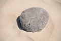 Stone on clear sand in beaches of Valdevaqueros , Tarifa in CÃÂ¡diz.