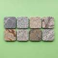 Stone coasters with rounded edges are arranged in two rows on a green Royalty Free Stock Photo