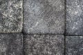 Stone cobblestones, background close-up. Natural texture. Dark gray backdrop or wallpaper. Rough surface. Aged effect shot. Royalty Free Stock Photo