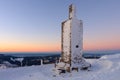 Stone column with height quota 1603 m in snezka, mountain on the border between Czech Republic and Poland, winter, sunrise time