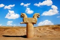 Stone column sculpture of a Griffin in Persepolis against a blue sky with clouds. The Victory symbol of the ancient Achaemenid Kin Royalty Free Stock Photo