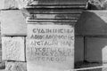 Stone columns written in ancient Greek in the open air museum of Turkey, Izmir, Ephesus. close up Royalty Free Stock Photo