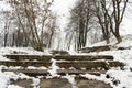 Stone concrete snow covered stairs in the city at winter. Stairway to heaven. Royalty Free Stock Photo