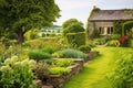 stone cottage with garden in countryside Royalty Free Stock Photo