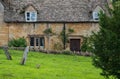 Stone cottages around the village green, photographed in the pretty Cotswold village of Snowshill near Broadway, UK