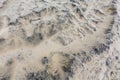 Stone covered sand, background. Royalty Free Stock Photo