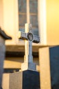 Stone cross on the cemetery, evening sun Royalty Free Stock Photo