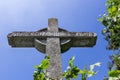 Stone cross on deep blue sky Royalty Free Stock Photo