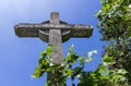 Stone cross on deep blue sky Royalty Free Stock Photo