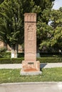 Stone cross in Echmiadzin Vagharshapat made of red stone tufa. Royalty Free Stock Photo