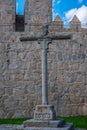 Stone cross in front of the walls of Avila Royalty Free Stock Photo