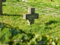 Stone cross on grave on old World War I Cemetery Royalty Free Stock Photo