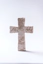 Stone cross with inscription Believe on grey background, Copy space. Christian backdrop. Biblical faith, gospel Royalty Free Stock Photo