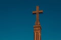 Stone cross khachkar of Khor Virap Monastery against blue sky. Religious landmark. Copy space for text. Religion symbol. Carved ch Royalty Free Stock Photo