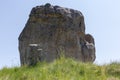 Stone cross on medieval Cossack grave against the single rock