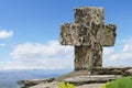 Stone cross at a mountain peak Royalty Free Stock Photo